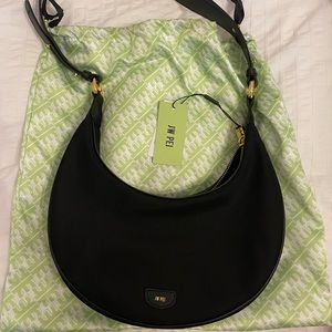 New with tags.  JW PEI Carly saddle bag